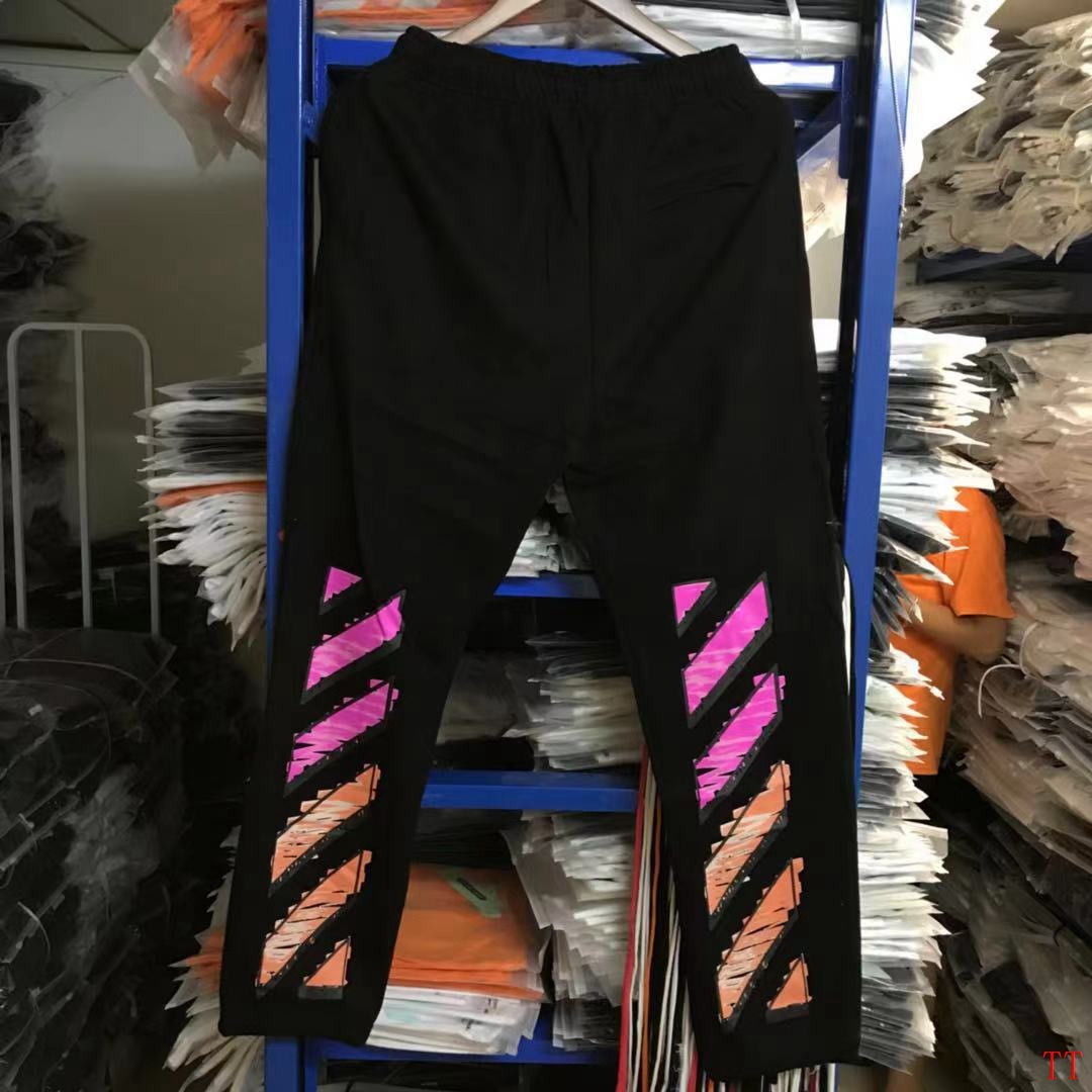 Off-White black track pants with pink and orange diagonal stripe print